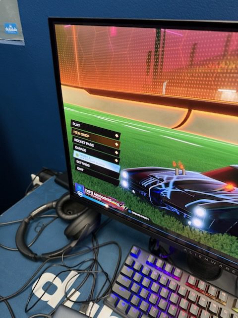 Gaming monitor, keyboard, and mouse at a DubDub AI Arcade station