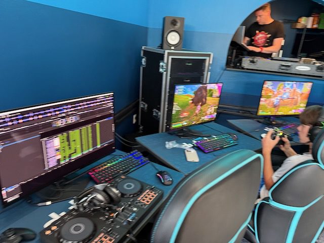 Gaming stations with controller play inside DubDub AI Arcade