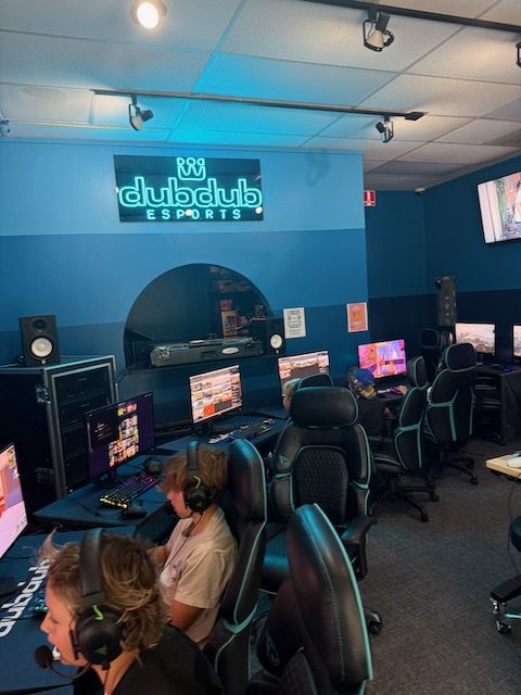 DubDub AI Arcade station row with players and wall logo