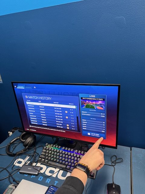 Gaming station login screen, keyboard, and mouse at DubDub AI Arcade